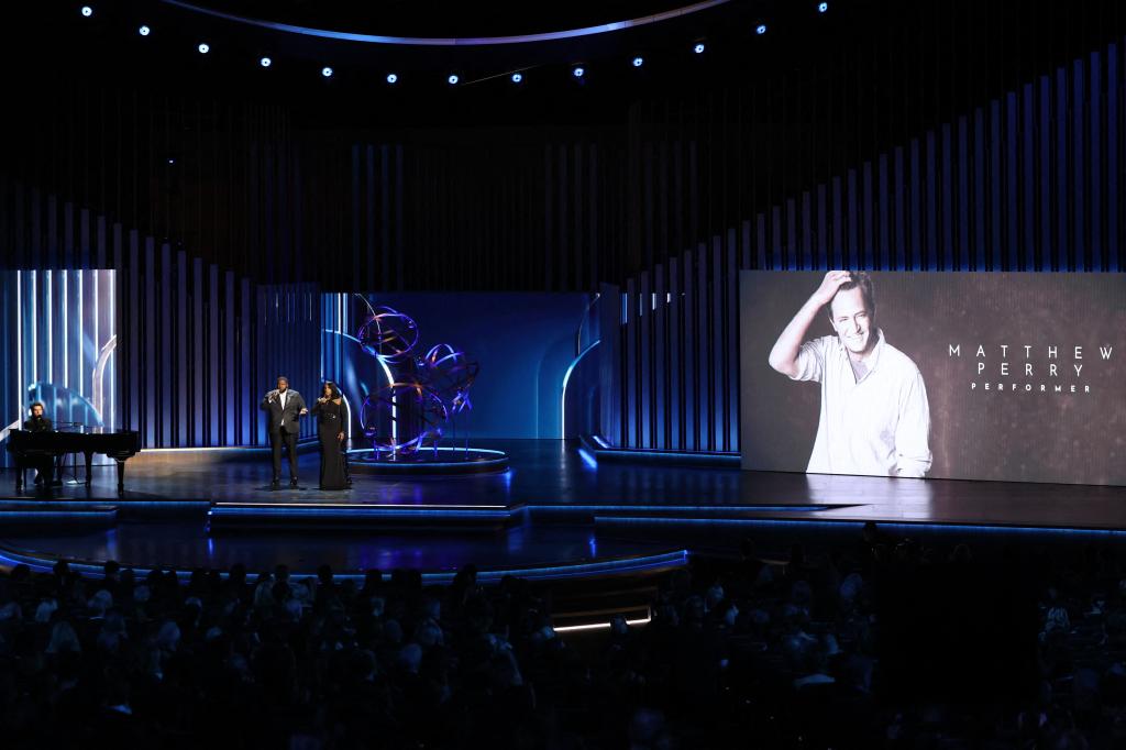 Charlie Puth onstage singing during Perry tribute at Emmys