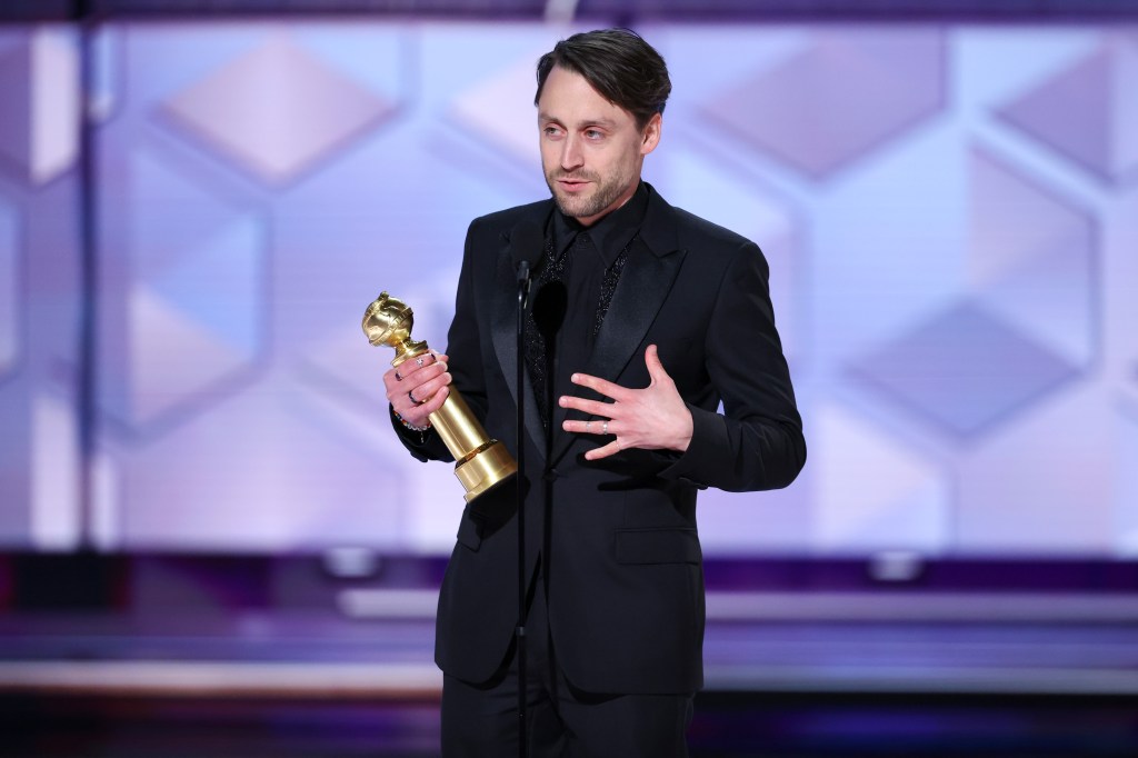 Kieran Culkin at the Golden Globes, with trophy in hand